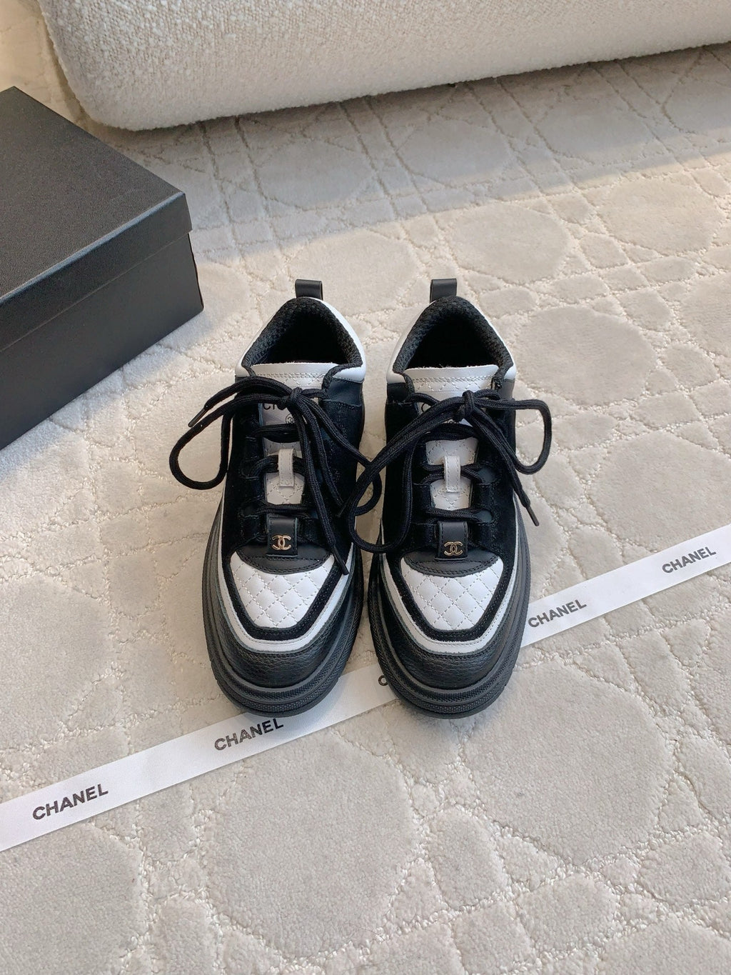 CHANEL 25S TRAINERS 40MM IN BLACK AND WHITE CALFSKIN AND SUEDE